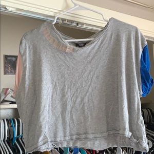 grey, pink, and blue crop top